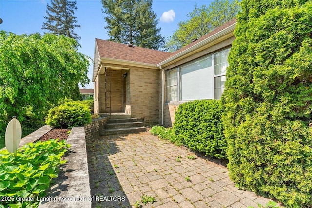 224 S Grace St, Lansing, MI 48917 - property entrance with brick siding