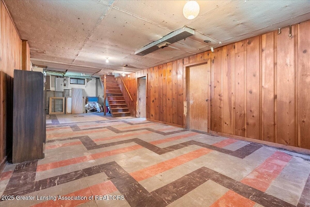 224 S Grace St, Lansing, MI 48917 - finished below grade area with tile patterned floors, stairway, and wooden walls