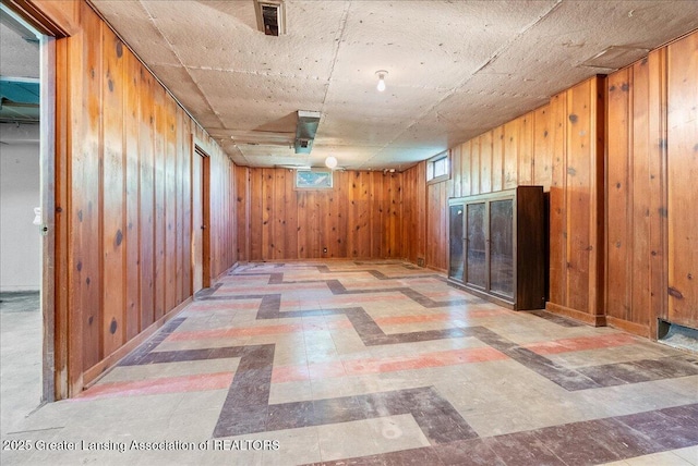 224 S Grace St, Lansing, MI 48917 - basement featuring tile patterned floors and wood walls
