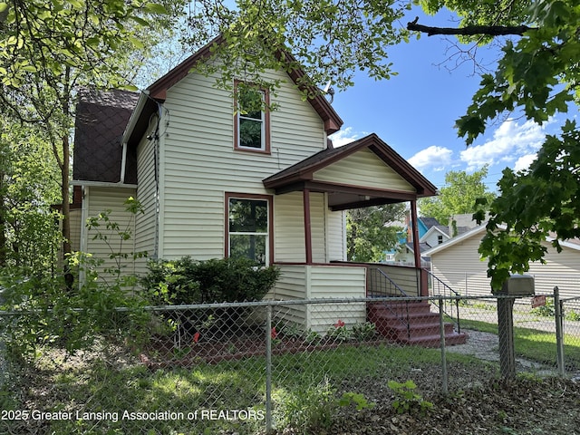 312 Jones St, Lansing, MI 48912 - view of front of property featuring roof with shingles