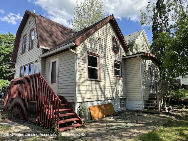 312 Jones St, Lansing, MI 48912 - back of property featuring stairway and a patio area