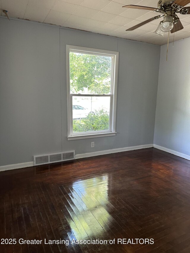 312 Jones St, Lansing, MI 48912 - empty room featuring hardwood / wood-style flooring, a ceiling fan, and baseboards