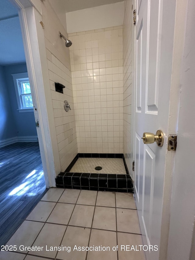 312 Jones St, Lansing, MI 48912 - full bathroom featuring a tile shower and tile patterned flooring