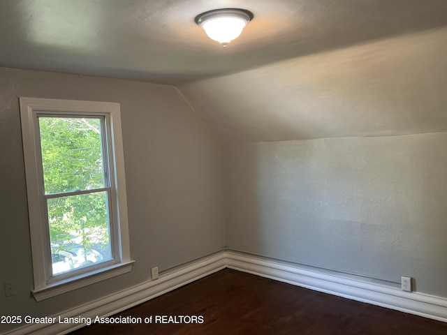312 Jones St, Lansing, MI 48912 - bonus room with vaulted ceiling and dark wood-style flooring