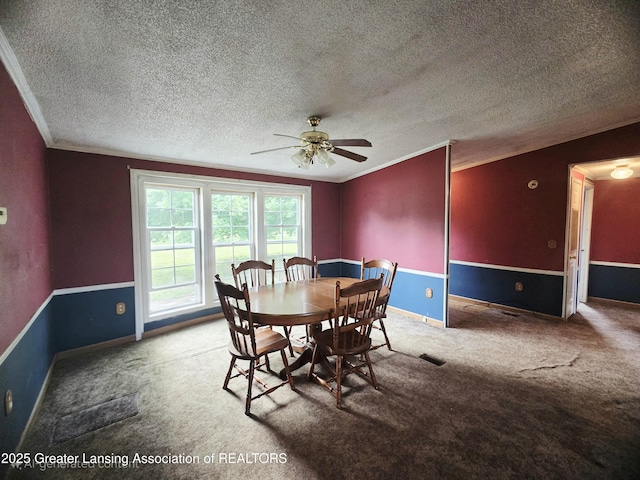 1279 Leland Rd, Ovid, MI 48866 - dining area with crown molding, ceiling fan, carpet flooring, a textured ceiling, and baseboards