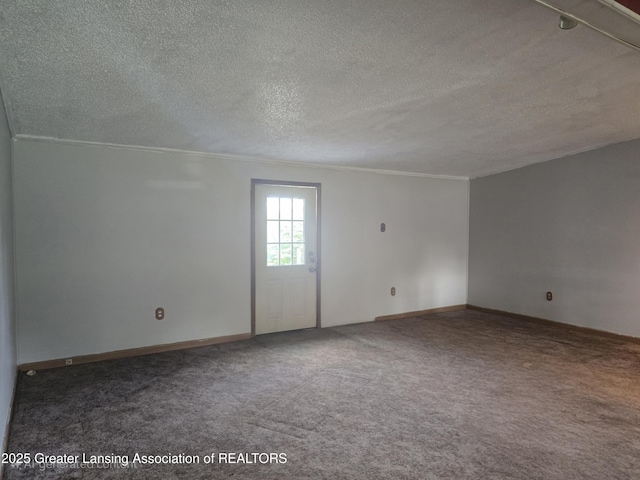 1279 Leland Rd, Ovid, MI 48866 - carpeted empty room featuring ornamental molding, a textured ceiling, and baseboards