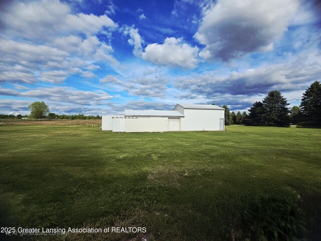 1279 Leland Rd, Ovid, MI 48866 - view of green lawn with an outbuilding