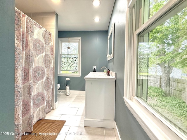 2215 Haslett Rd, East Lansing, MI 48823 - bathroom featuring vanity, toilet, recessed lighting, baseboards, and tile patterned flooring