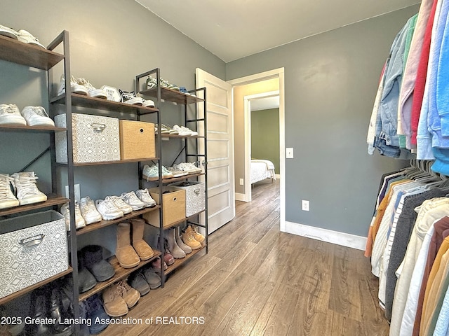 2215 Haslett Rd, East Lansing, MI 48823 - walk in closet with wood finished floors
