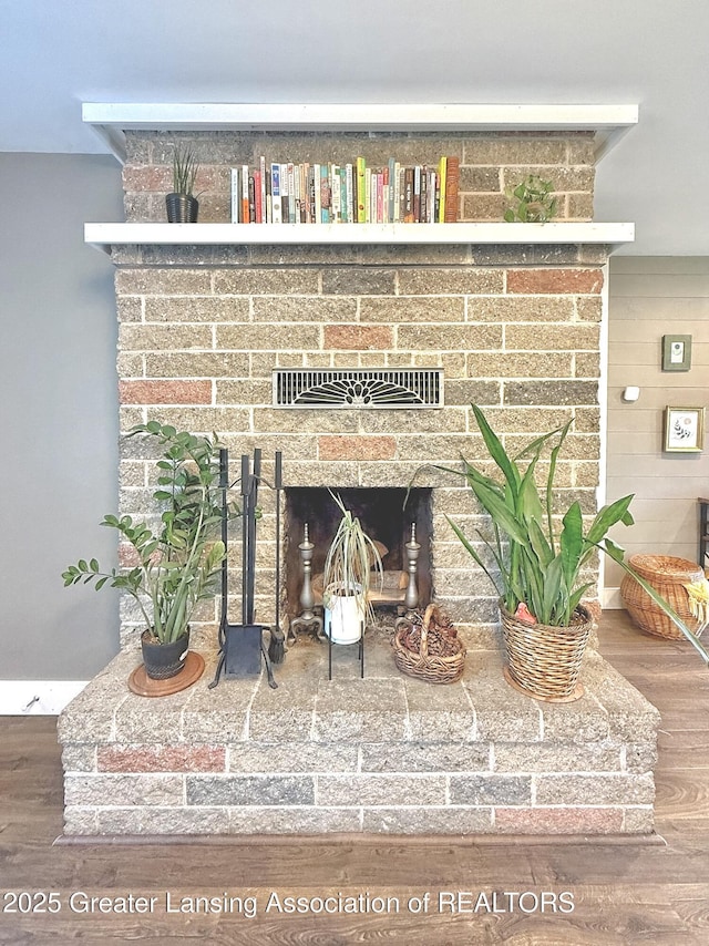 2215 Haslett Rd, East Lansing, MI 48823 - detailed view of a fireplace and wood finished floors