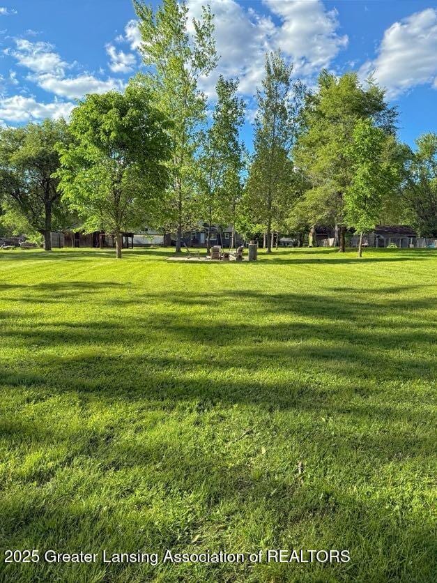 2215 Haslett Rd, East Lansing, MI 48823 - view of home's community with a yard