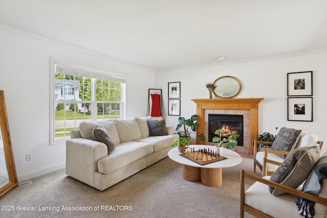 3795 Kirkland Ridge Dr, Holt, MI 48842 - living area featuring crown molding, carpet floors, baseboards, and a tile fireplace