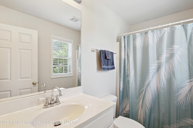 3795 Kirkland Ridge Dr, Holt, MI 48842 - full bathroom with toilet, vanity, and curtained shower