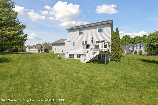 3795 Kirkland Ridge Dr, Holt, MI 48842 - back of house featuring stairway, a wooden deck, and a yard