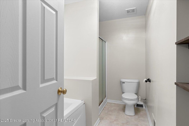5859 Printemp Dr, East Lansing, MI 48823 - bathroom featuring baseboards, toilet, a shower stall, and a garden tub