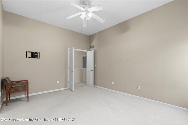 5859 Printemp Dr, East Lansing, MI 48823 - unfurnished bedroom featuring light colored carpet, baseboards, and ceiling fan