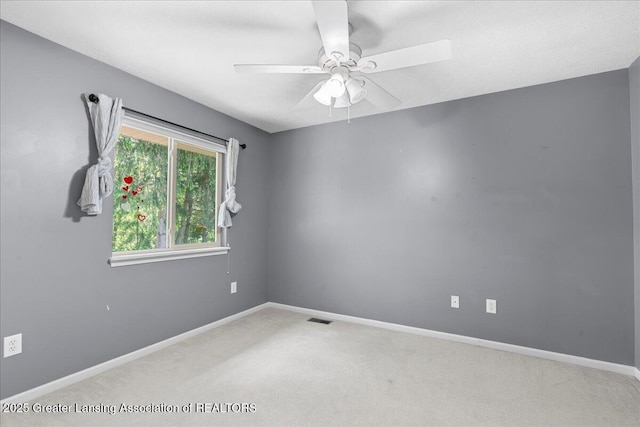 5859 Printemp Dr, East Lansing, MI 48823 - carpeted spare room with baseboards and ceiling fan