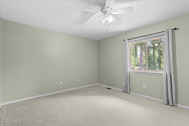 5859 Printemp Dr, East Lansing, MI 48823 - empty room featuring carpet floors, ceiling fan, baseboards, and a textured ceiling