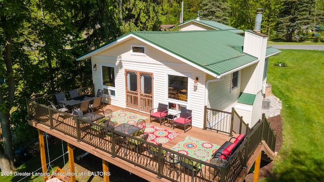 6391 Lakeshore Dr, Lakeview, MI 48850 - wooden deck with a lawn and outdoor dining area