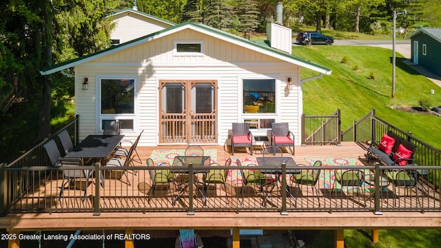 6391 Lakeshore Dr, Lakeview, MI 48850 - rear view of property with a wooden deck, a chimney, and a yard