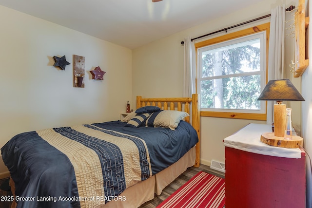 6391 Lakeshore Dr, Lakeview, MI 48850 - bedroom featuring wood finished floors and baseboards