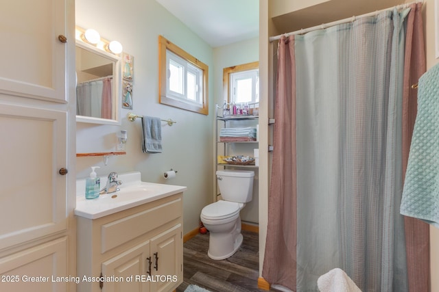 6391 Lakeshore Dr, Lakeview, MI 48850 - full bathroom with toilet, wood finished floors, vanity, and a shower with curtain