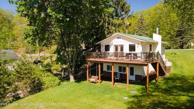 6391 Lakeshore Dr, Lakeview, MI 48850 - back of house featuring a wooden deck, a chimney, a lawn, and stairway