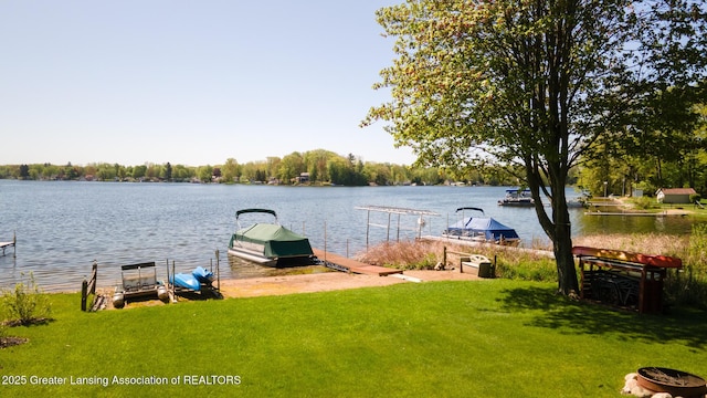 6391 Lakeshore Dr, Lakeview, MI 48850 - dock with a water view and a lawn