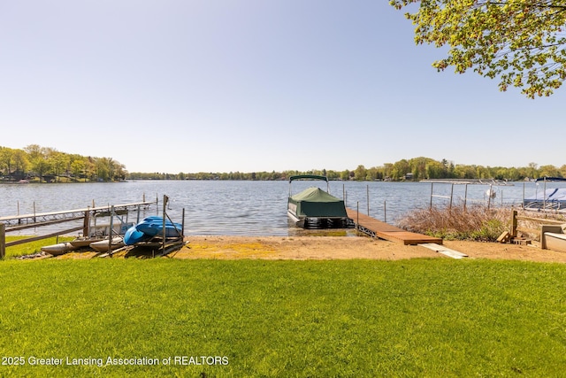 6391 Lakeshore Dr, Lakeview, MI 48850 - dock area featuring a lawn and a water view