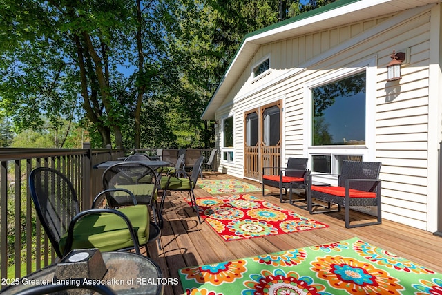 6391 Lakeshore Dr, Lakeview, MI 48850 - wooden terrace with outdoor dining area and french doors