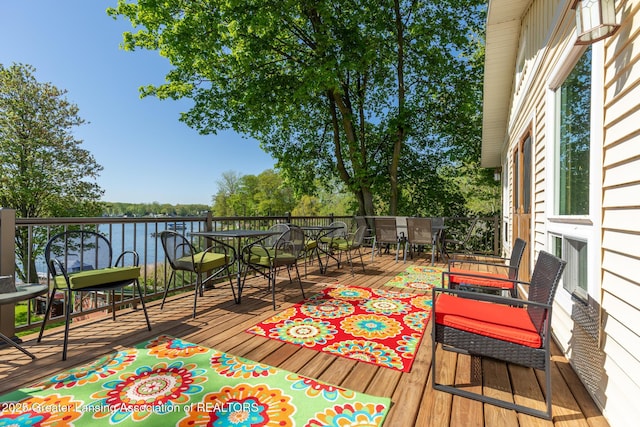 6391 Lakeshore Dr, Lakeview, MI 48850 - wooden terrace with outdoor dining area and a water view