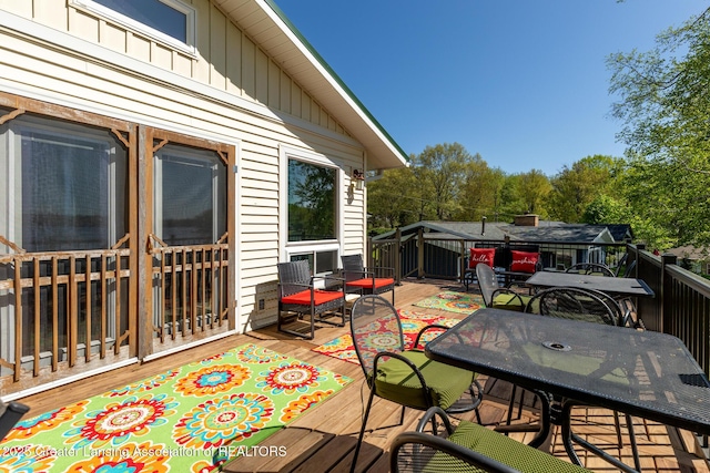 6391 Lakeshore Dr, Lakeview, MI 48850 - wooden deck featuring outdoor dining space
