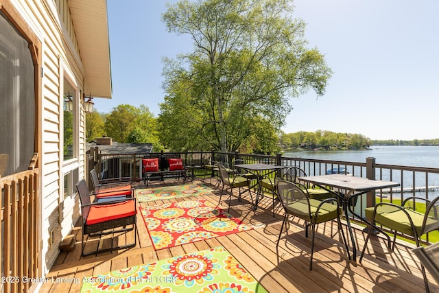 6391 Lakeshore Dr, Lakeview, MI 48850 - deck with a water view and outdoor dining area