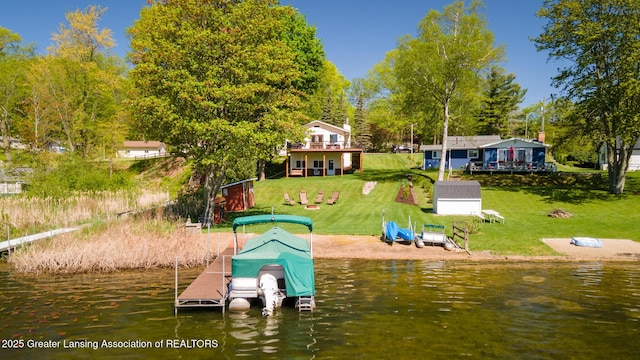 6391 Lakeshore Dr, Lakeview, MI 48850 - dock area with a water view, a lawn, and boat lift