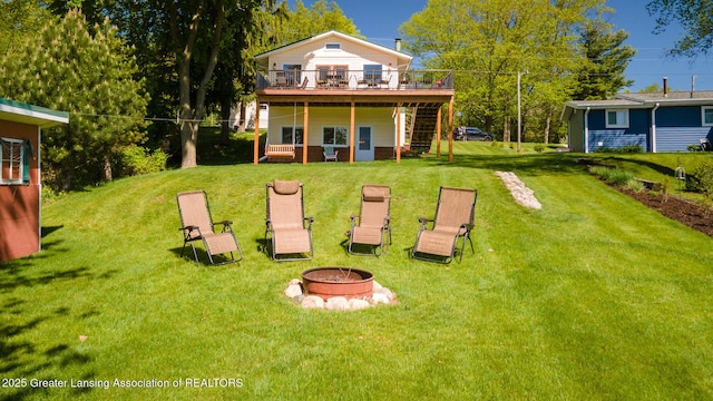 6391 Lakeshore Dr, Lakeview, MI 48850 - rear view of property featuring a fire pit, a wooden deck, a yard, and stairway