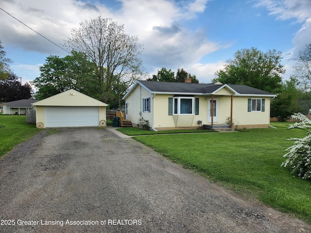 136 N Chestnut St, Owosso, MI 48867 - ranch-style home with an outdoor structure, a detached garage, a chimney, and a front yard