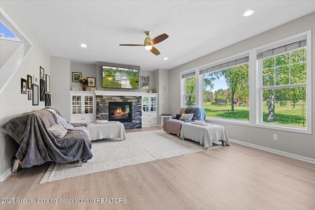 4150 Stillbrook Ln, Dewitt, MI 48820 - living area featuring wood finished floors, ceiling fan, baseboards, and recessed lighting