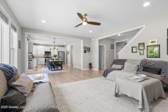 4150 Stillbrook Ln, Dewitt, MI 48820 - living room featuring light wood-style flooring, recessed lighting, a ceiling fan, and baseboards