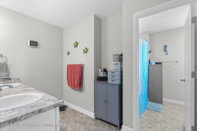4150 Stillbrook Ln, Dewitt, MI 48820 - full bathroom with baseboards, double vanity, and a shower with curtain