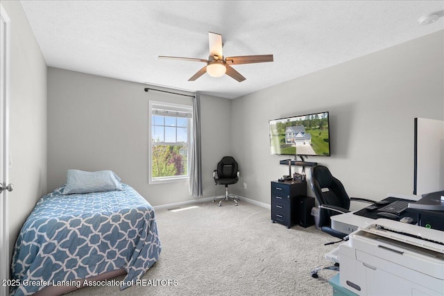 4150 Stillbrook Ln, Dewitt, MI 48820 - carpeted bedroom with a desk, baseboards, ceiling fan, and a textured ceiling
