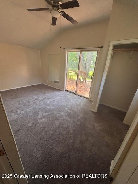 107 Cox Blvd, Lansing, MI 48910 - carpeted spare room featuring lofted ceiling, a ceiling fan, and baseboards