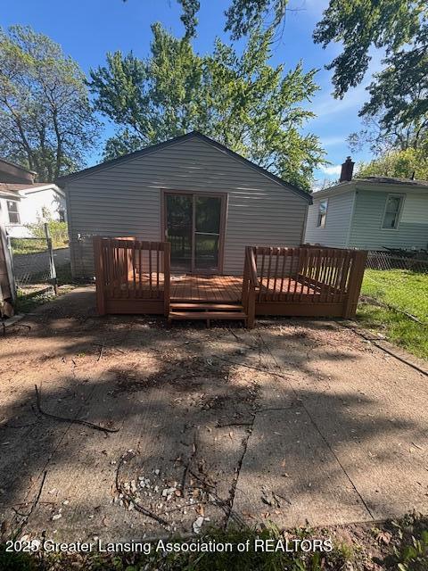 107 Cox Blvd, Lansing, MI 48910 - back of property with a wooden deck