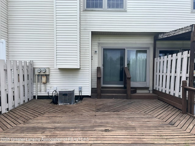 7436 Creekside Dr Unit 10, Lansing, MI 48917 - wooden deck featuring central air condition unit