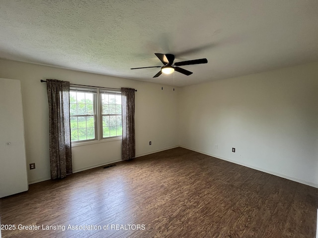 7436 Creekside Dr Unit 10, Lansing, MI 48917 - unfurnished room with dark wood finished floors, ceiling fan, and baseboards