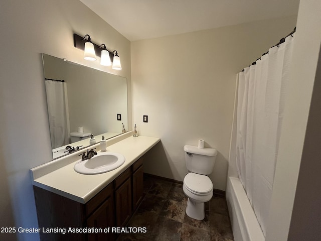 7436 Creekside Dr Unit 10, Lansing, MI 48917 - bathroom featuring toilet, vanity, a shower with curtain, and baseboards