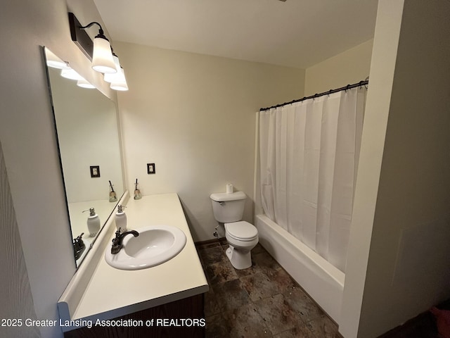 7436 Creekside Dr Unit 10, Lansing, MI 48917 - full bath with toilet, vanity, and stone finish flooring