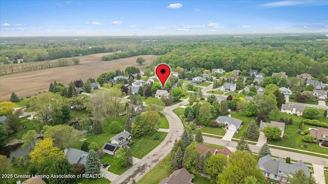 3720 Lott Ave, Holt, MI 48842 - aerial view of property and surrounding area with nearby suburban area and a heavily wooded area