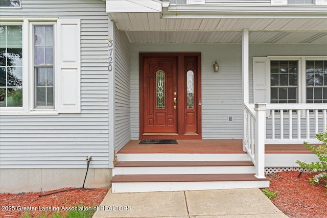 3720 Lott Ave, Holt, MI 48842 - doorway to property with a porch