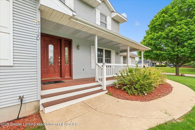 3720 Lott Ave, Holt, MI 48842 - property entrance featuring a porch