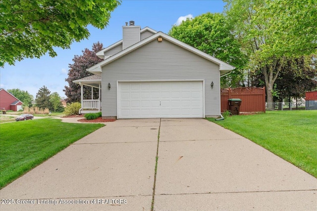 3720 Lott Ave, Holt, MI 48842 - view of front facade featuring concrete driveway, a chimney, and an attached garage
